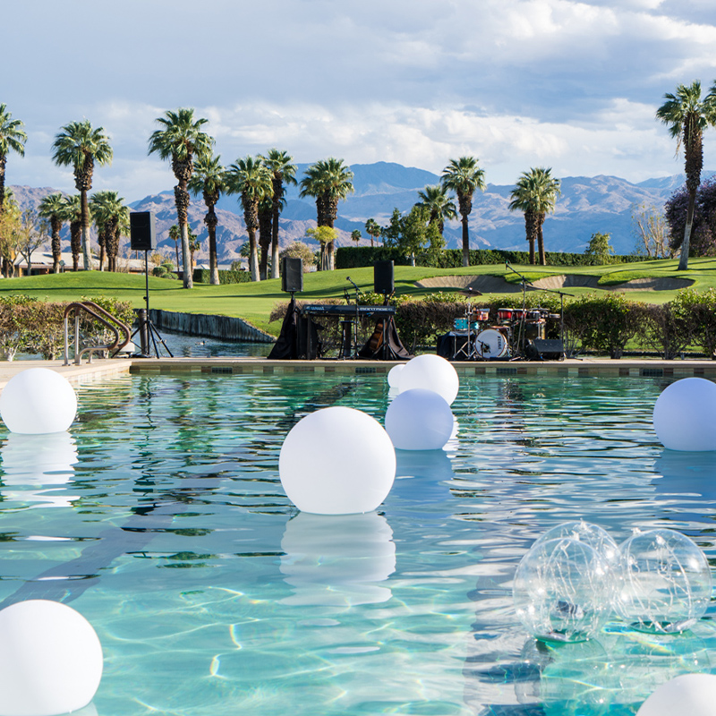 pool with white floaties overlooking Palm Springs desert backdrop