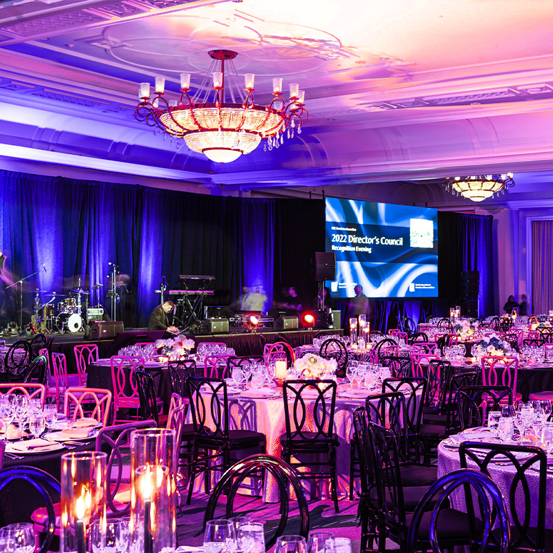 Miami convention center decorated with blue and purple lights