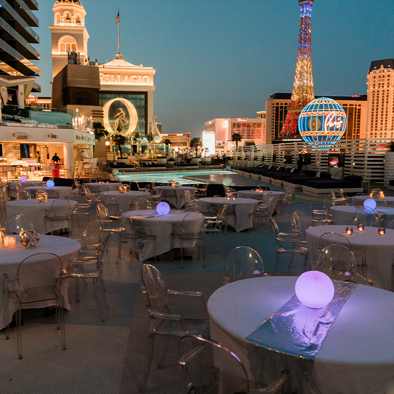 dining on a rooftop with a skyline view of historic buildings